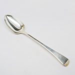 An antique sterling silver serving spoon by Albert Hernu