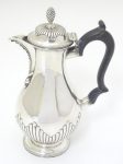 A Victorian silver coffee pot with ebonised handle