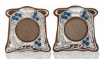 A PAIR OF SILVER, ENAMEL AND OAK PHOTOGRAPH FRAMES