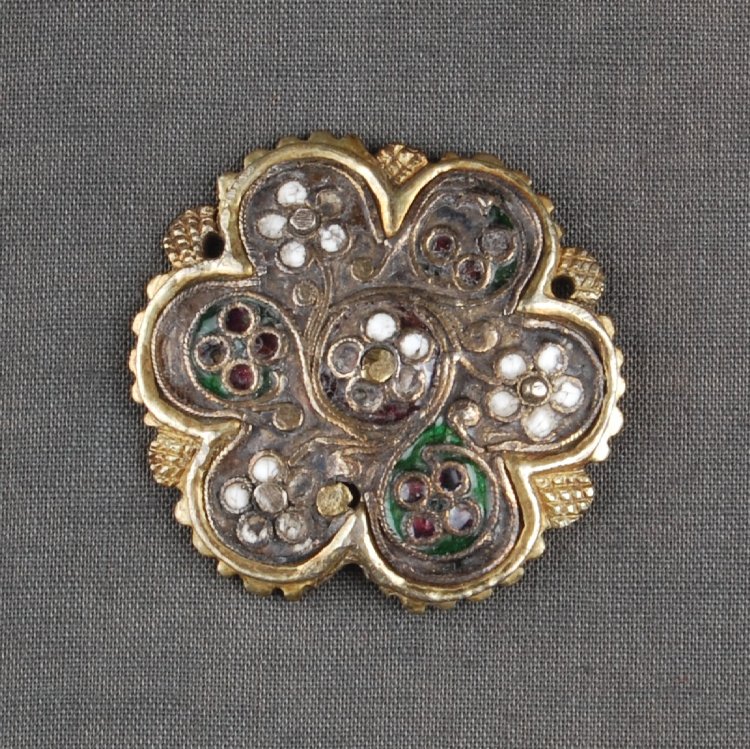 Belt-fitting; silver-gilt, enamel; circular lobed fitting with scalloped edges alternating with stylised leaves