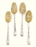 Four matching George III parcel-gilt silver berry spoons