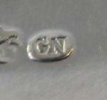 George Nangle silver makers mark found on a fish slice with a London assay mark