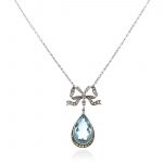 AN ANTIQUE AQUAMARINE AND DIAMOND PENDANT NECKLACE in yellow gold and silver
