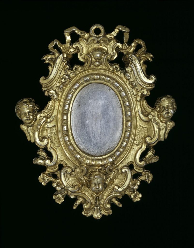 Frame for a miniature: silver gilt with rococo scrolls and cherubs.