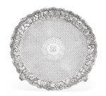 An American sterling silver floral-repoussé-decorated footed salver by S. Kirk & Son., Baltimore, MD, late 19th century