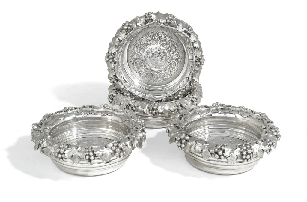 A set of four George IV silver wine bottle coasters, Benjamin Smith, London, 1820