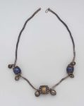Silver chain, 2 large lapis lazuli ornaments, 1 large silver ornament.