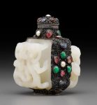 A silver snuff bottle inset with white jade belt buckle sections Bottle: Republic period; jade: 18th century