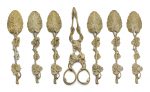 A set of six George III silver-gilt teaspoons and a pair of sugar tongs, one spoon stamped 'SH', otherwise unmarked, circa 1820